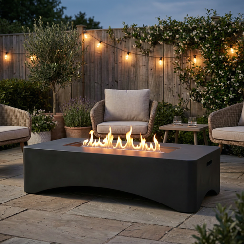 56-inch dark grey propane fire pit table with lit flame on a patio