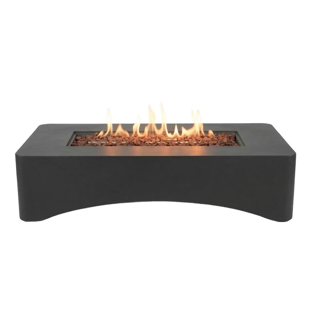 Propane fire pit table shown on a backyard deck at dusk
